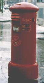 Red pillar box with the word URGENT written on the side.