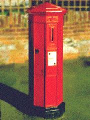 Octagonal pillar box with vertical aperture.