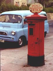 Edward VIII pillar box with POST OFFICE direction sign.