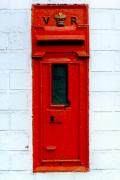 V.R. post box set in a wall.